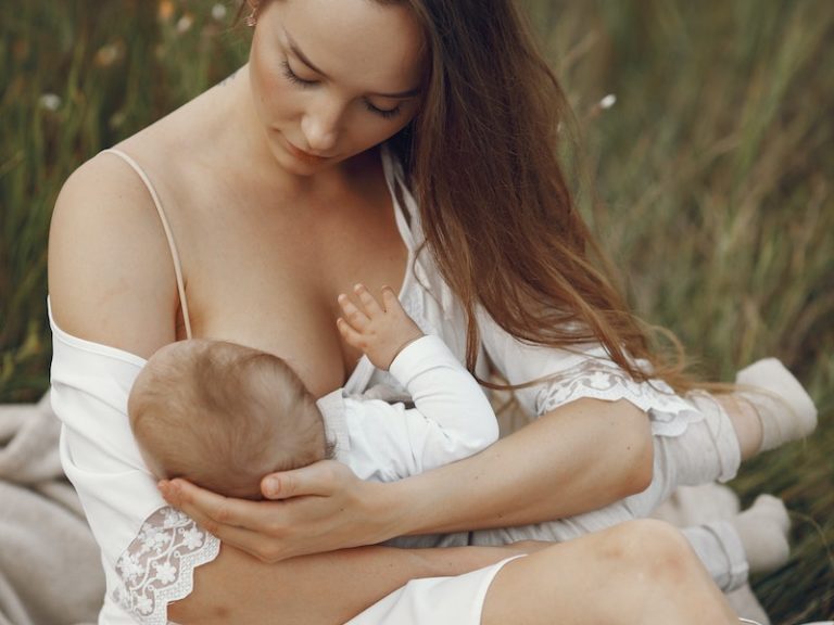 Woman Breastfeeding Her Baby 