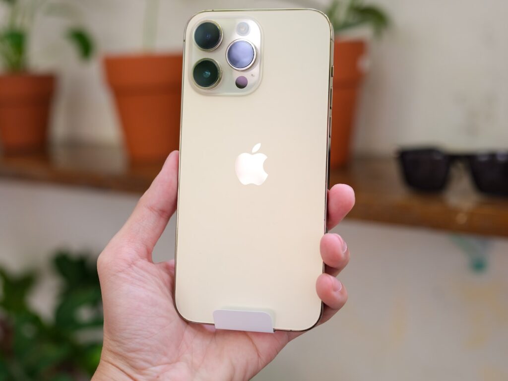 a person holding an iphone in their hand